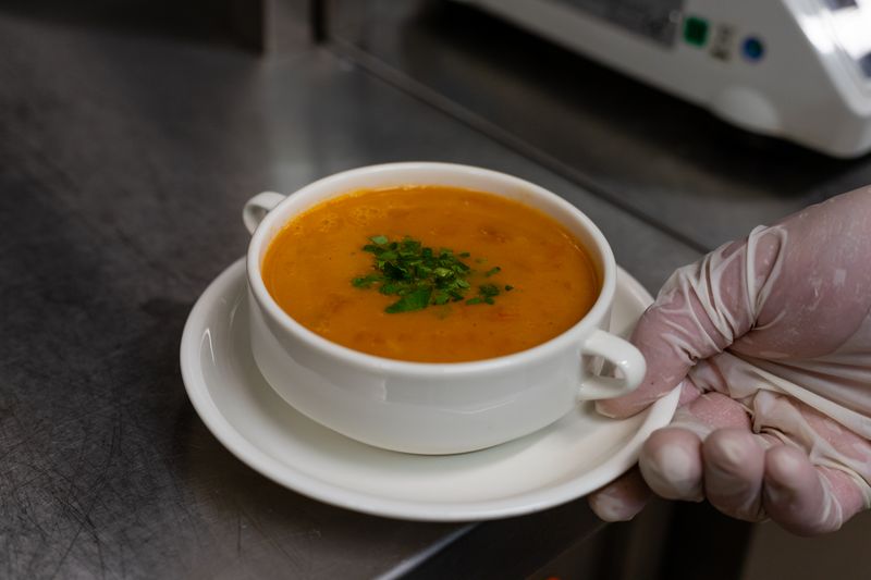 Zupas tomato basil bisque soup in a bowl